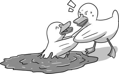 a rubber duck pulling another out of tar