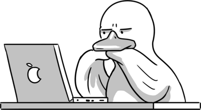 a rubber duck looking seriously at a laptop
